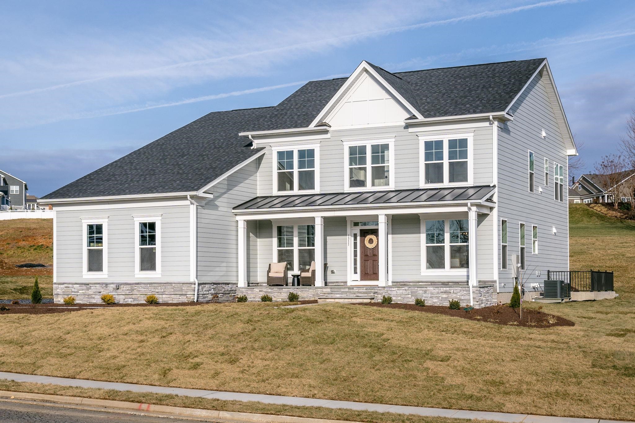 front view of a house with a yard