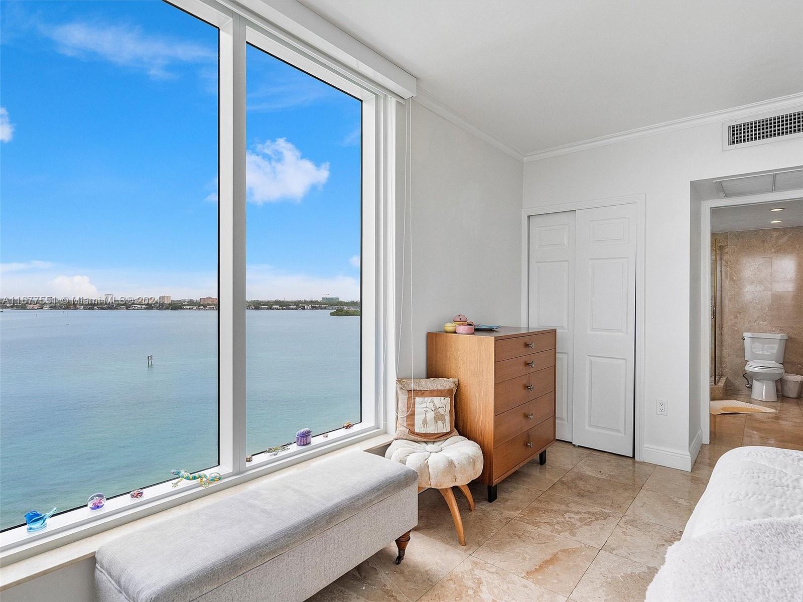 a bedroom with furniture and window