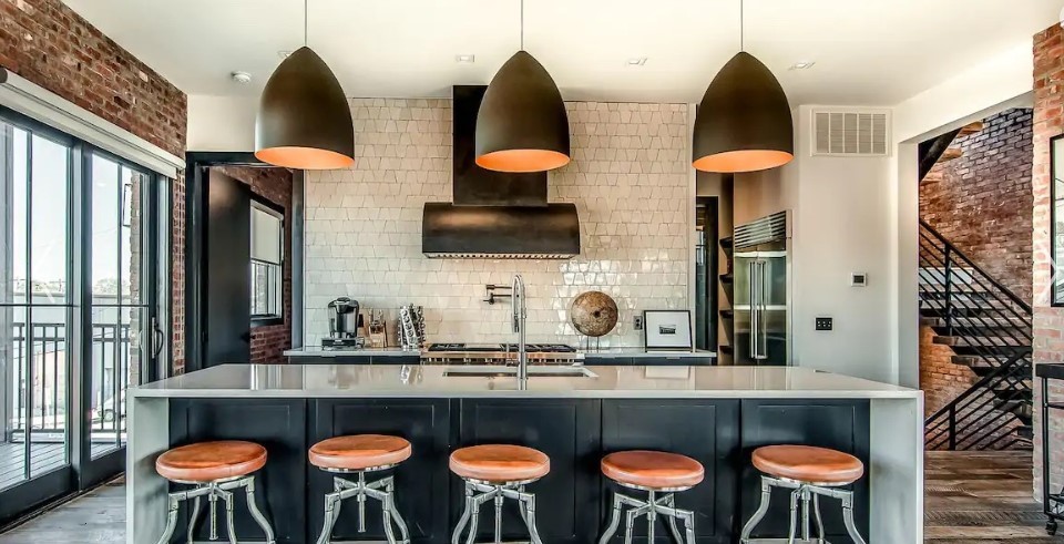 a kitchen with a table and chairs in it