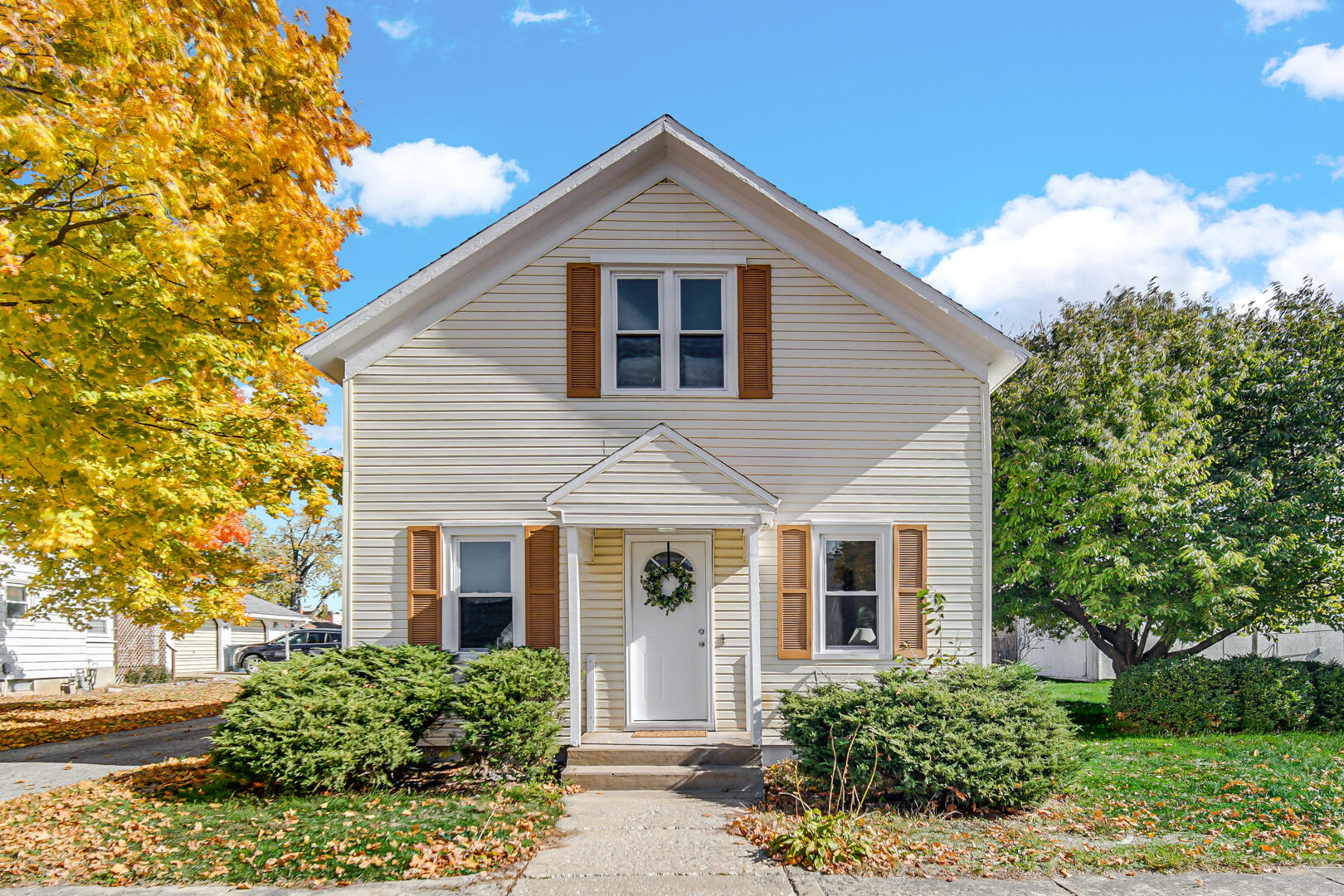 front view of a house with a yard