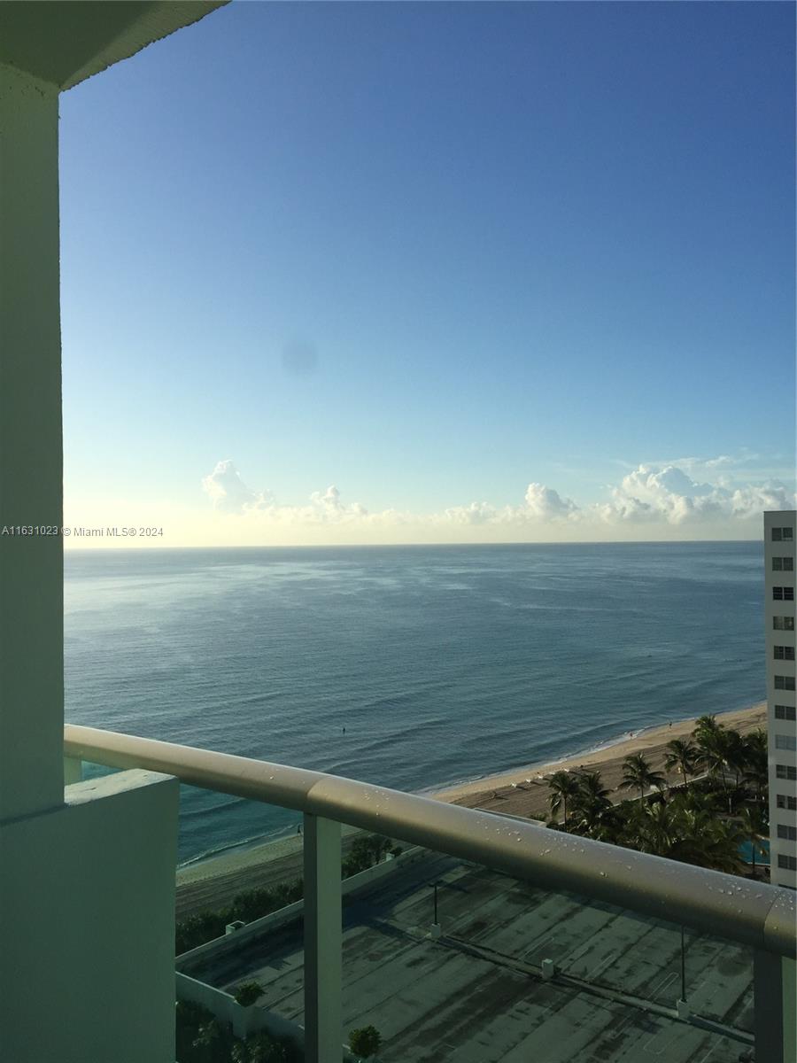 a view of an ocean from a balcony