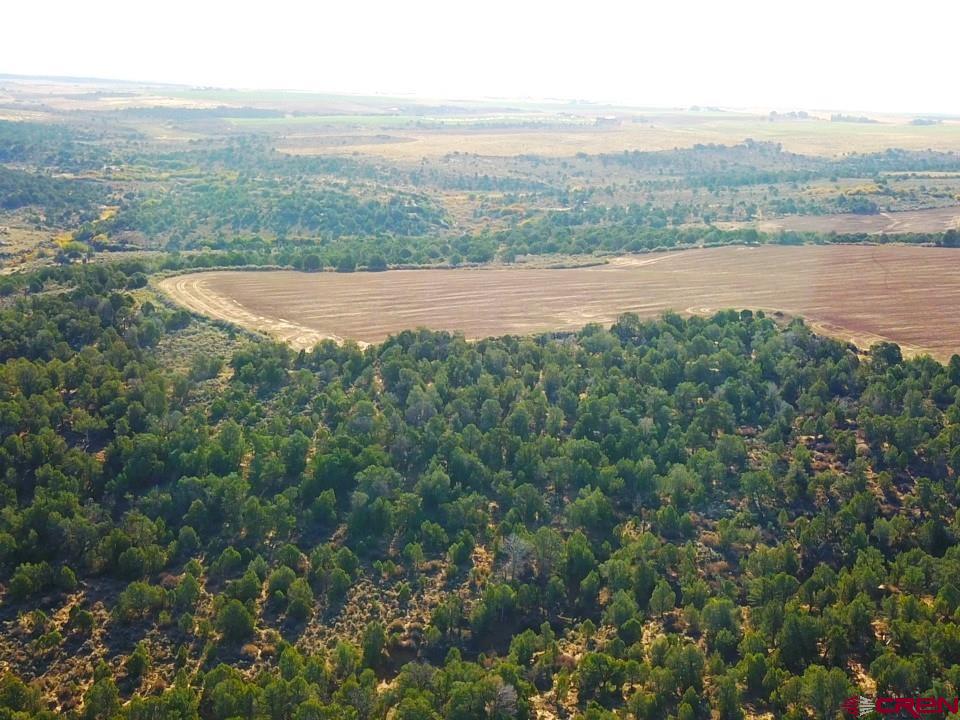 an aerial view of mountain with lake view