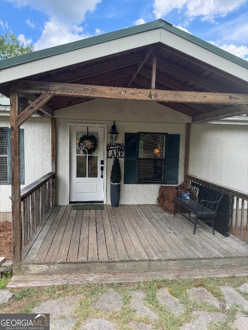 a view of a house with a door and wooden floor