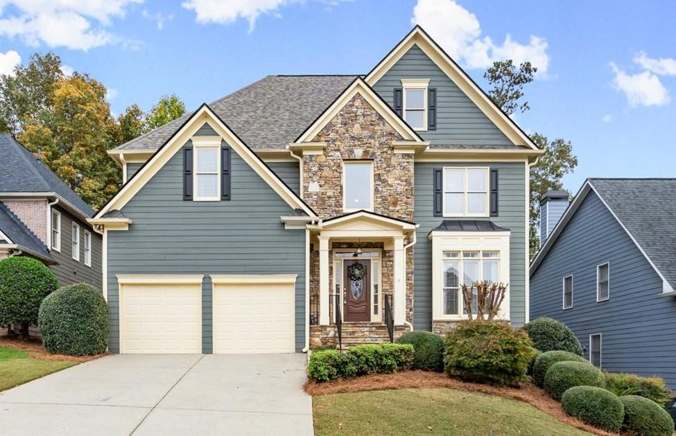 a front view of a house with a yard