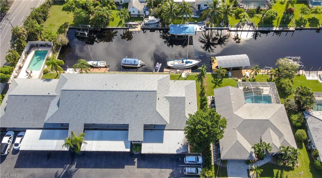 a aerial view of a house with swimming pool and sitting area