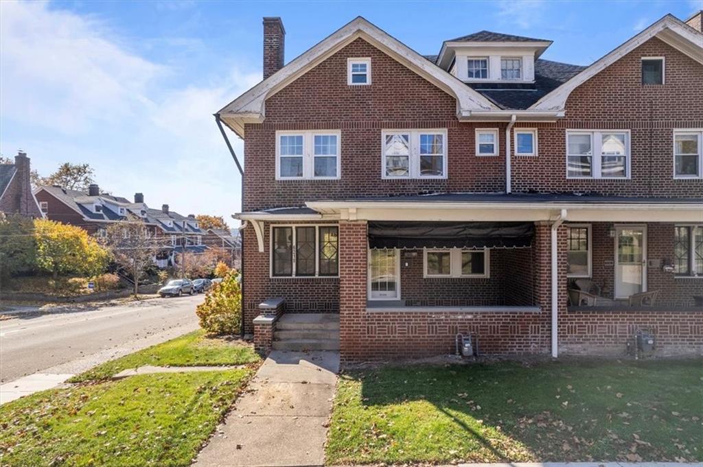 a front view of a house with a yard