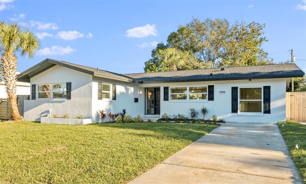 a front view of a house with a yard