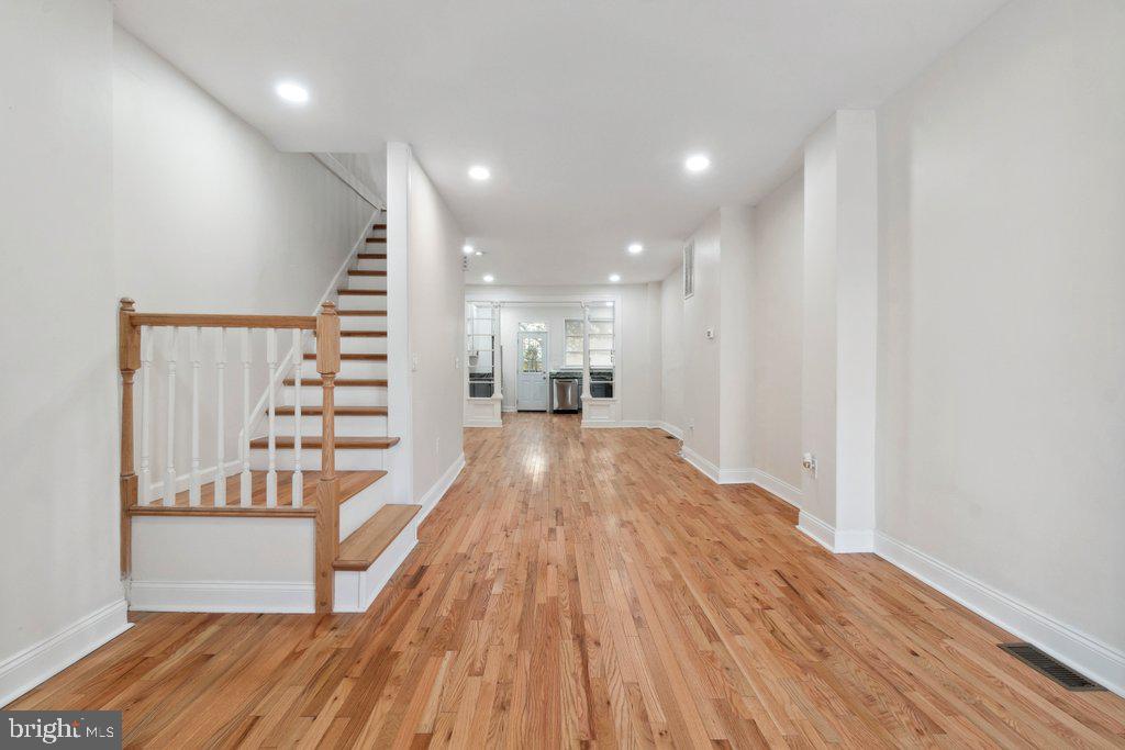 a view of a living room and wooden floor