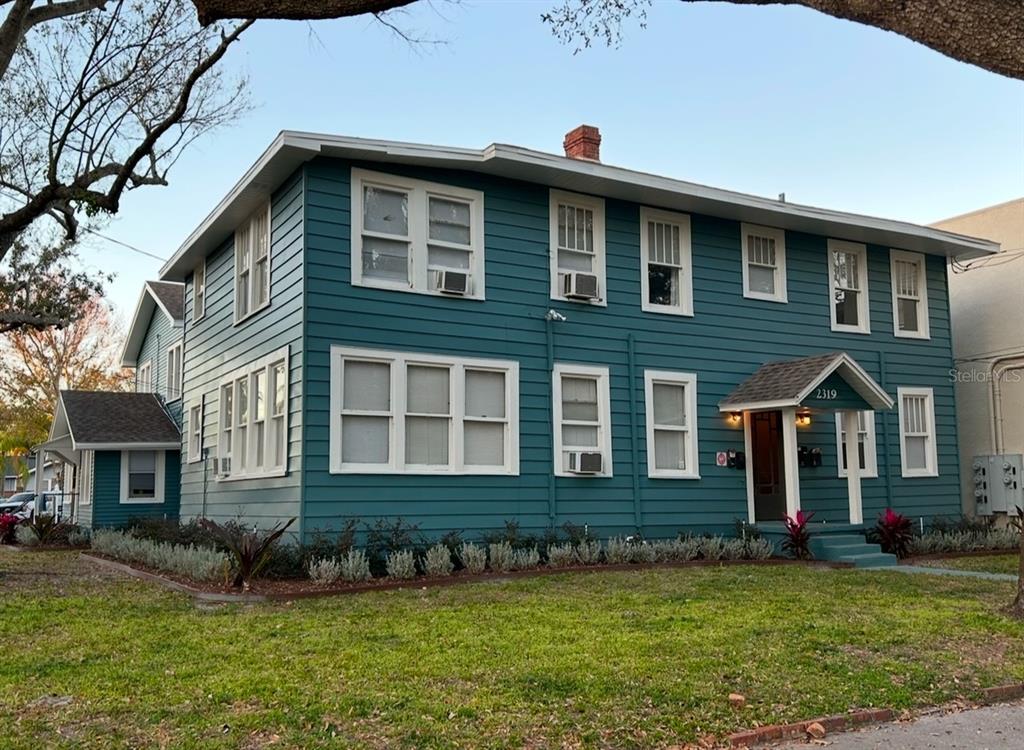 a front view of a house with a yard