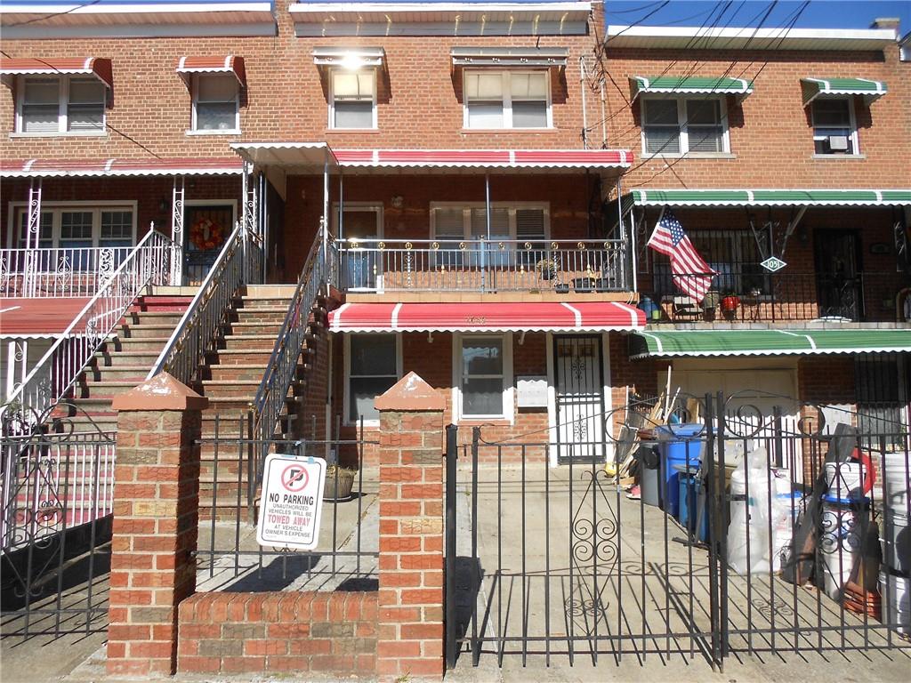 View of front of house with a balcony