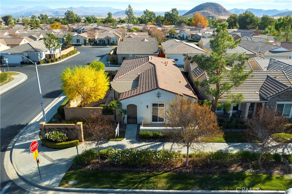 an aerial view of a house with a swimming pool yard and outdoor seating