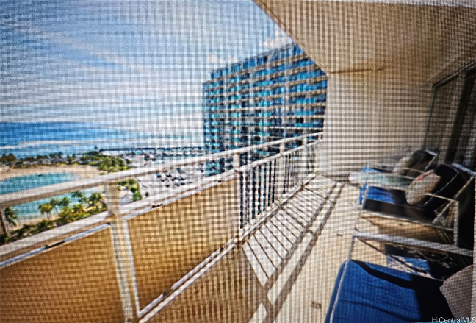 a view of a balcony with wooden floor and outdoor space