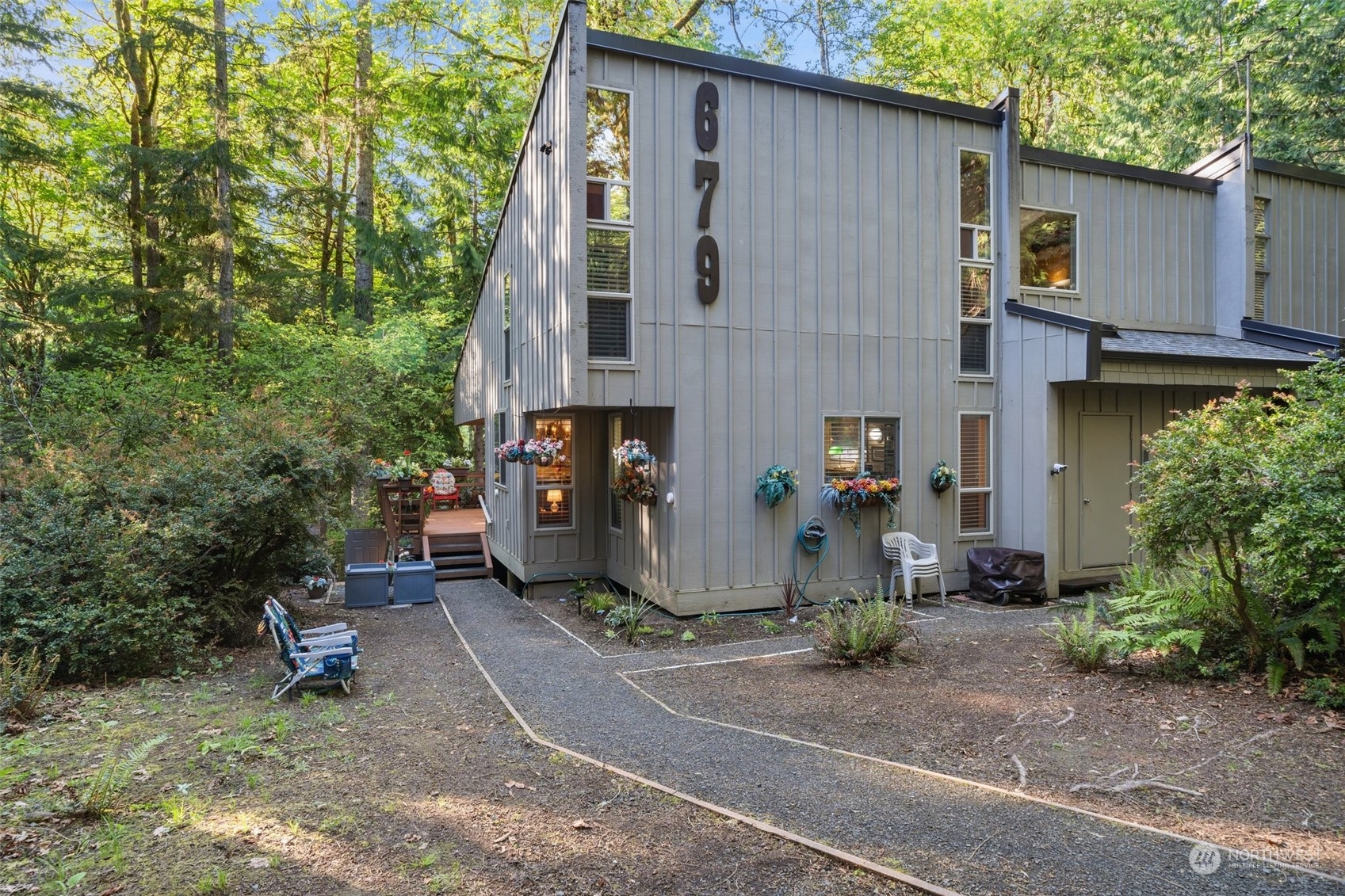 a backyard of a house with outdoor seating and yard