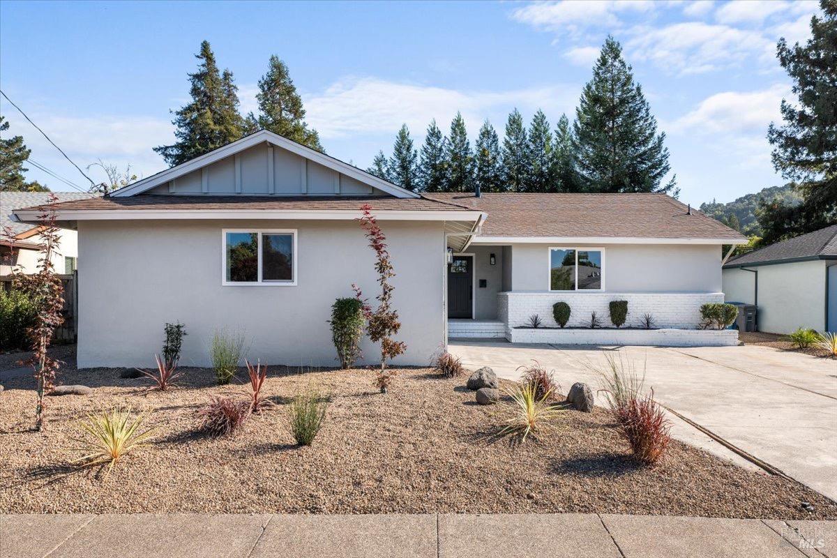 a front view of a house with yard