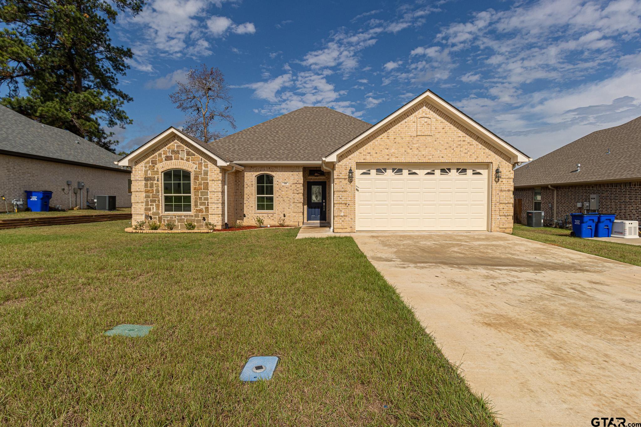 front view of a house with a yard