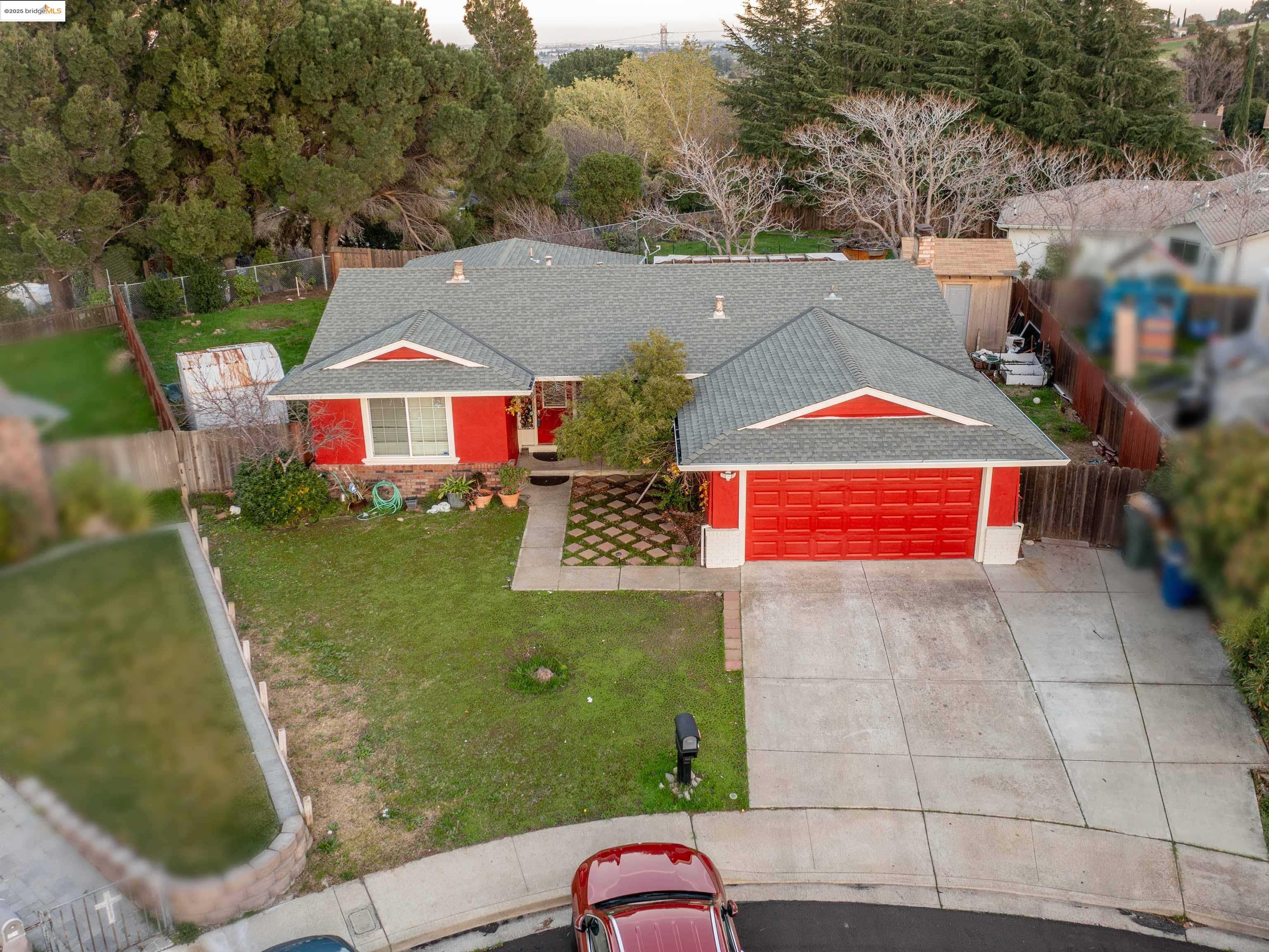 an aerial view of a houses with yard