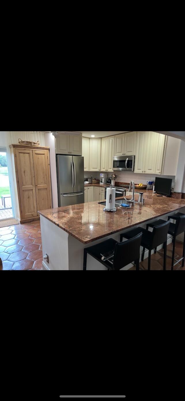 a view of kitchen with breakfast area