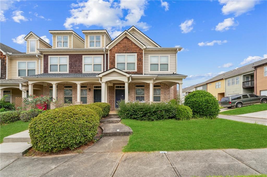 a front view of a house with a yard