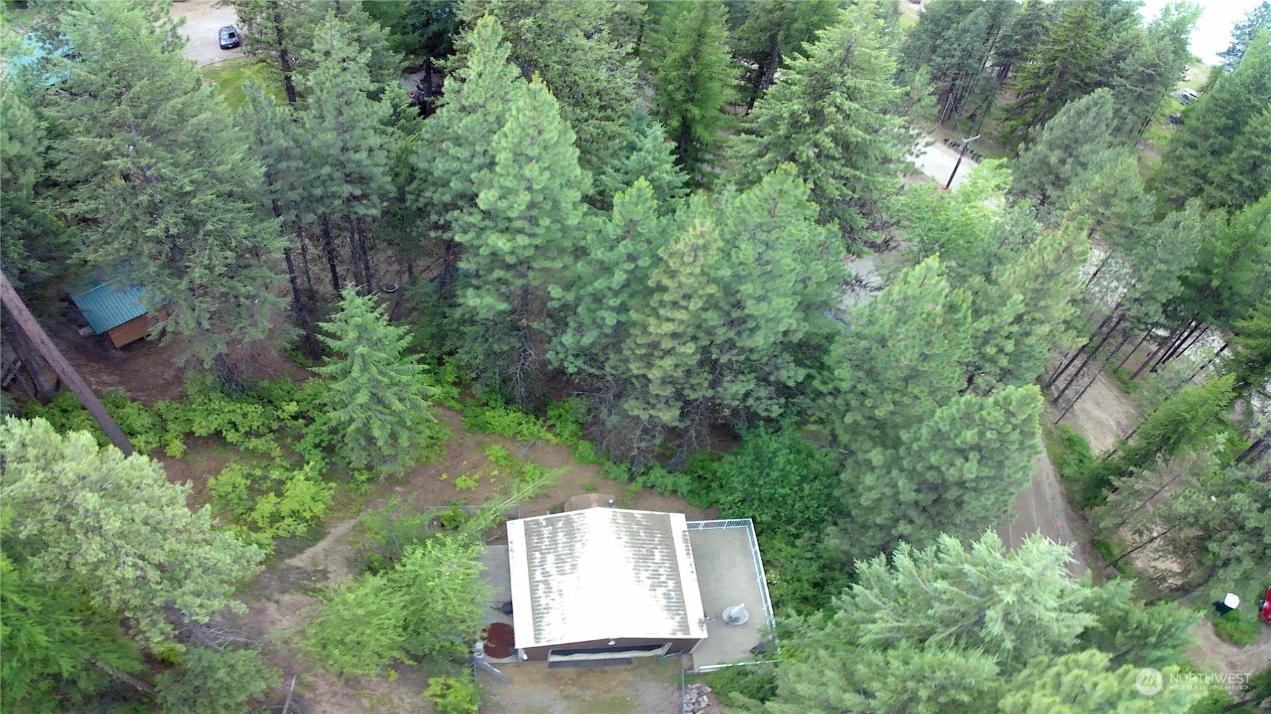 an aerial view of a house with yard