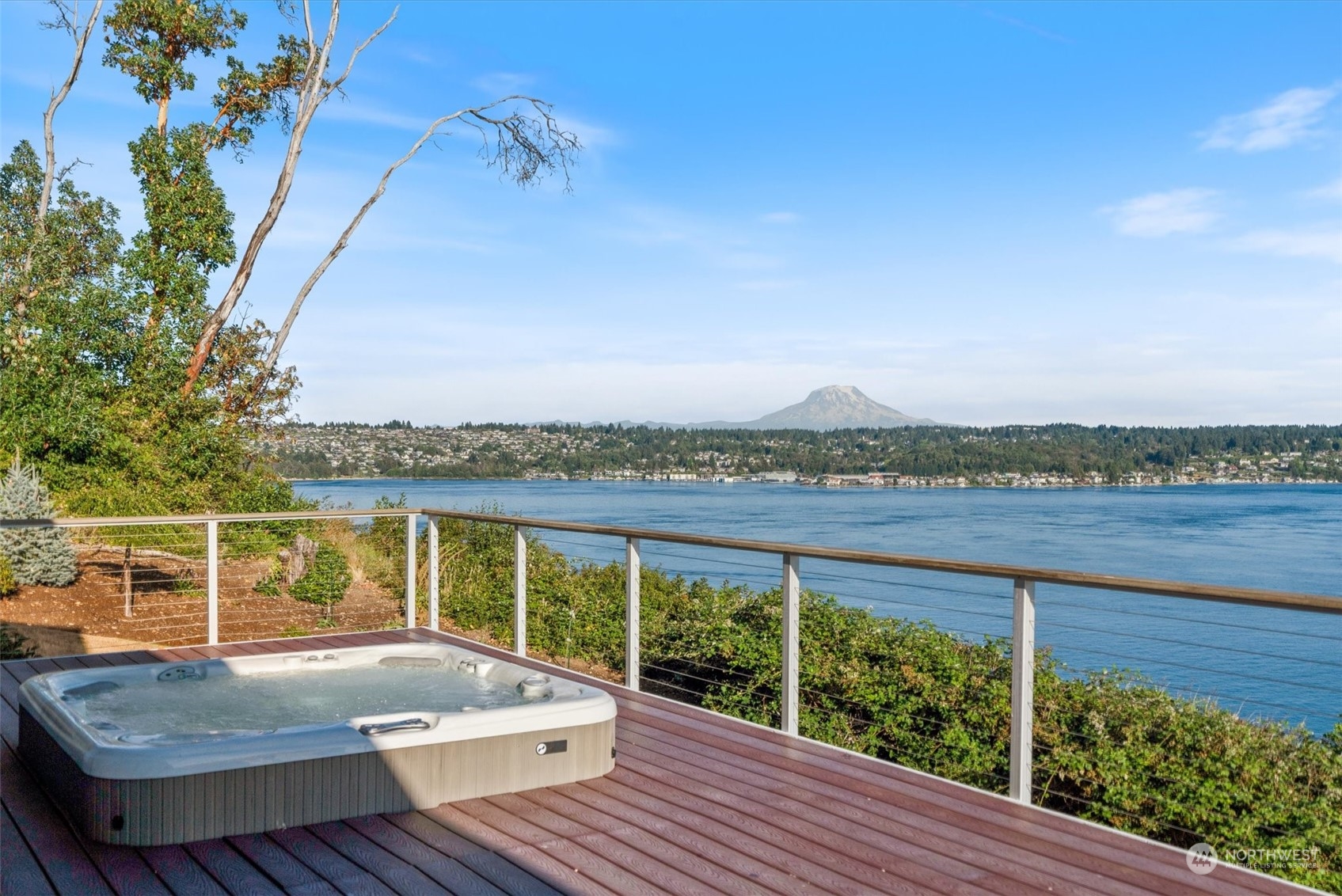 a view of a balcony with mountain view and wooden floor