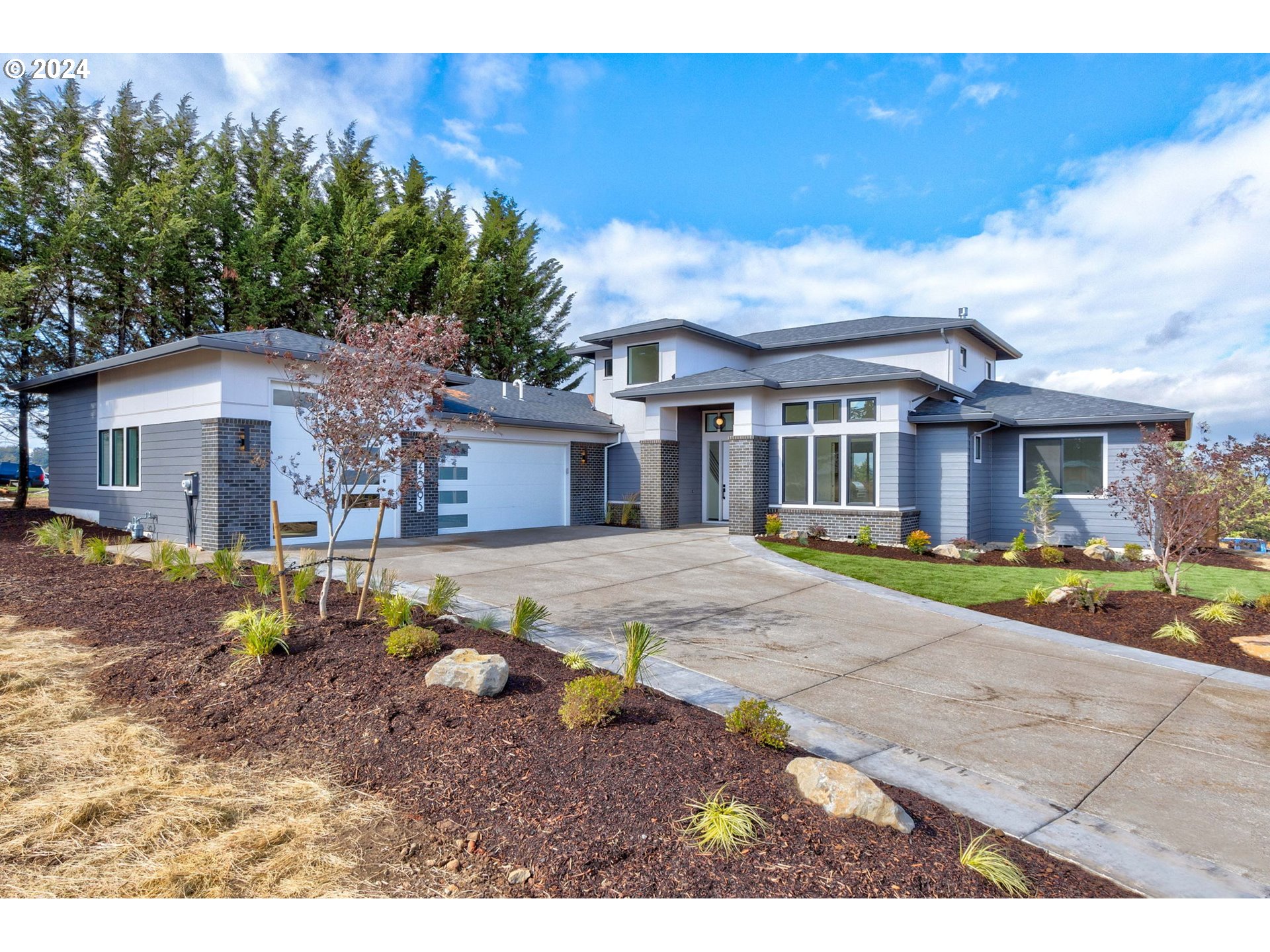 a front view of a house with a yard