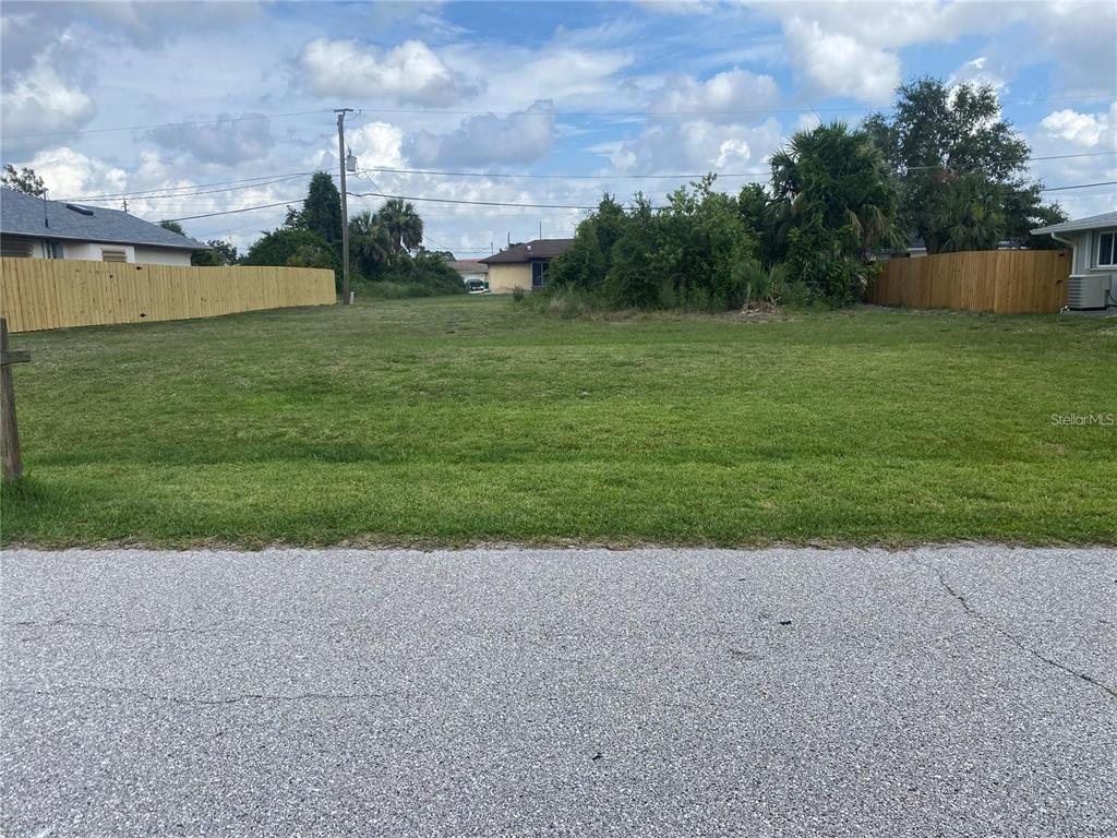 a view of a field with a big yard