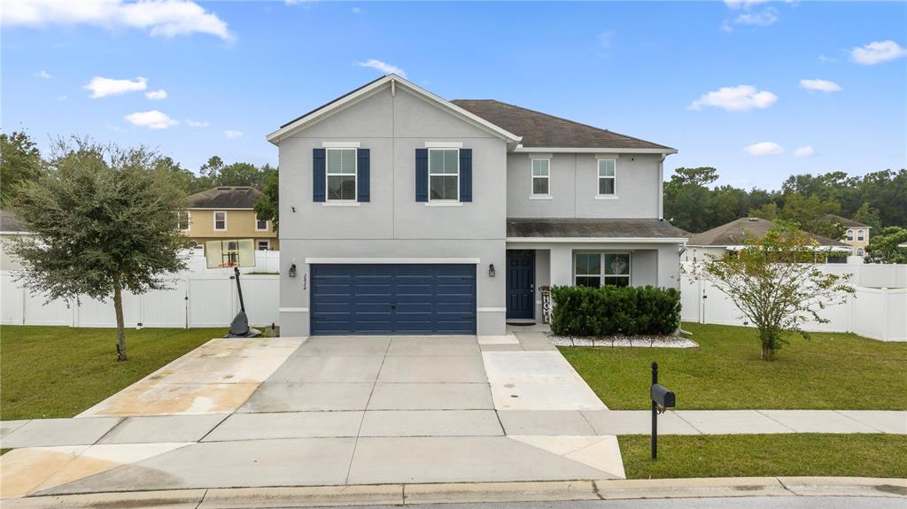 a view of house with yard and entertaining space