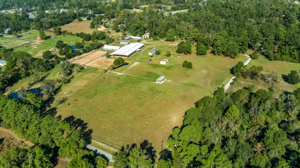 Nestled in the heart of Magnolia, Texas, this stunning 30-acre property epitomizes the beauty and tranquility of horse country. With rolling pastures, mature trees, and scenic views, it provides the perfect setting for equestrian enthusiasts. The expansive land offers ample space for horses to roam, while the peaceful surroundings make it an ideal retreat for those seeking a country lifestyle just outside the hustle and bustle of city life. The property seamlessly blends rustic charm with modern amenities.