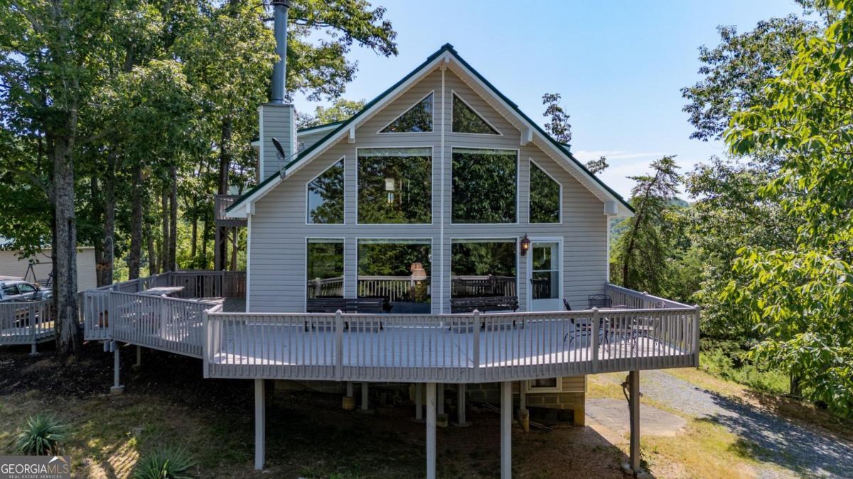 a front view of a house with table and chairs