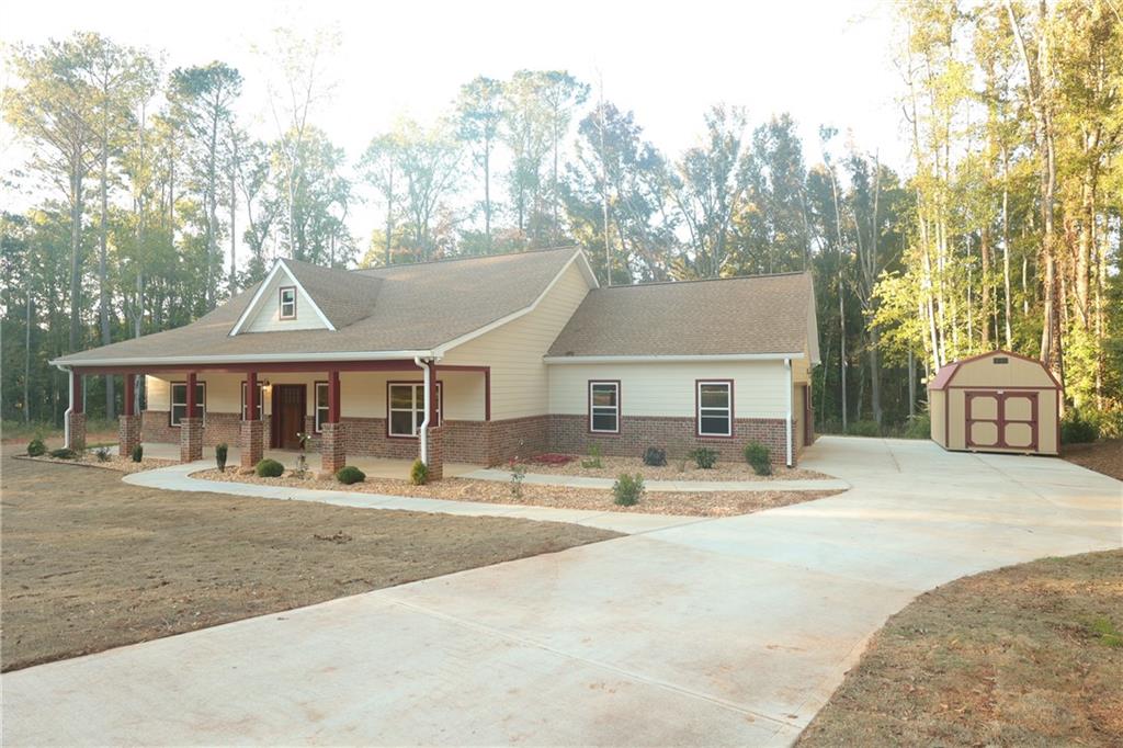 a front view of a house with garden