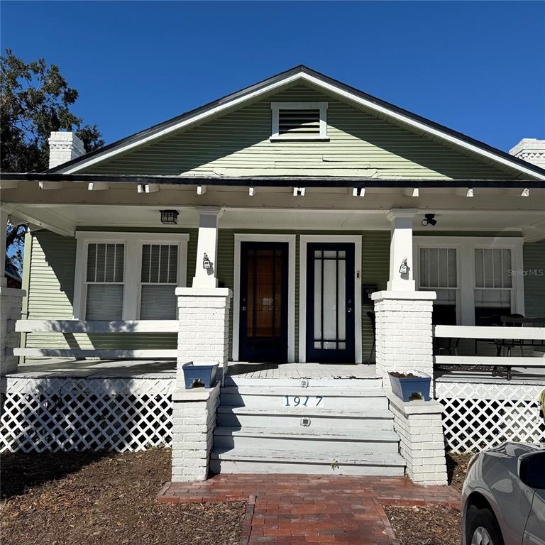 a front view of a house with a large window