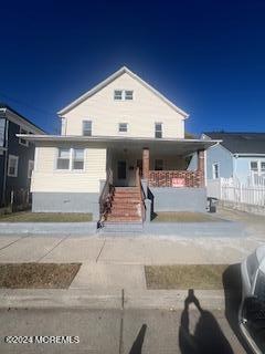 a front view of a house with garage