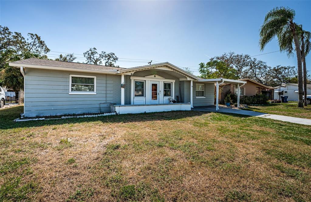 a front view of a house with garden