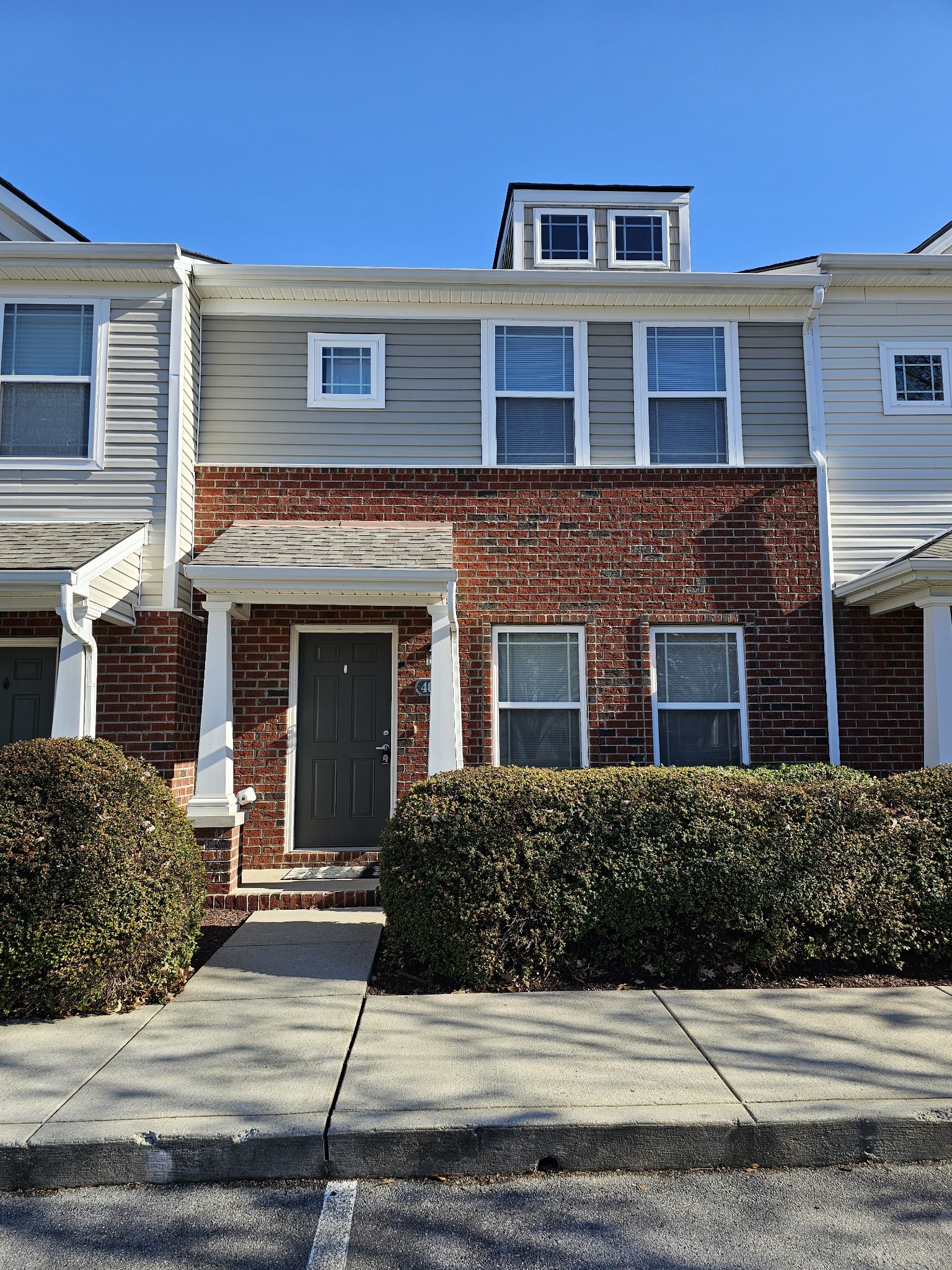 a front view of a house with yard