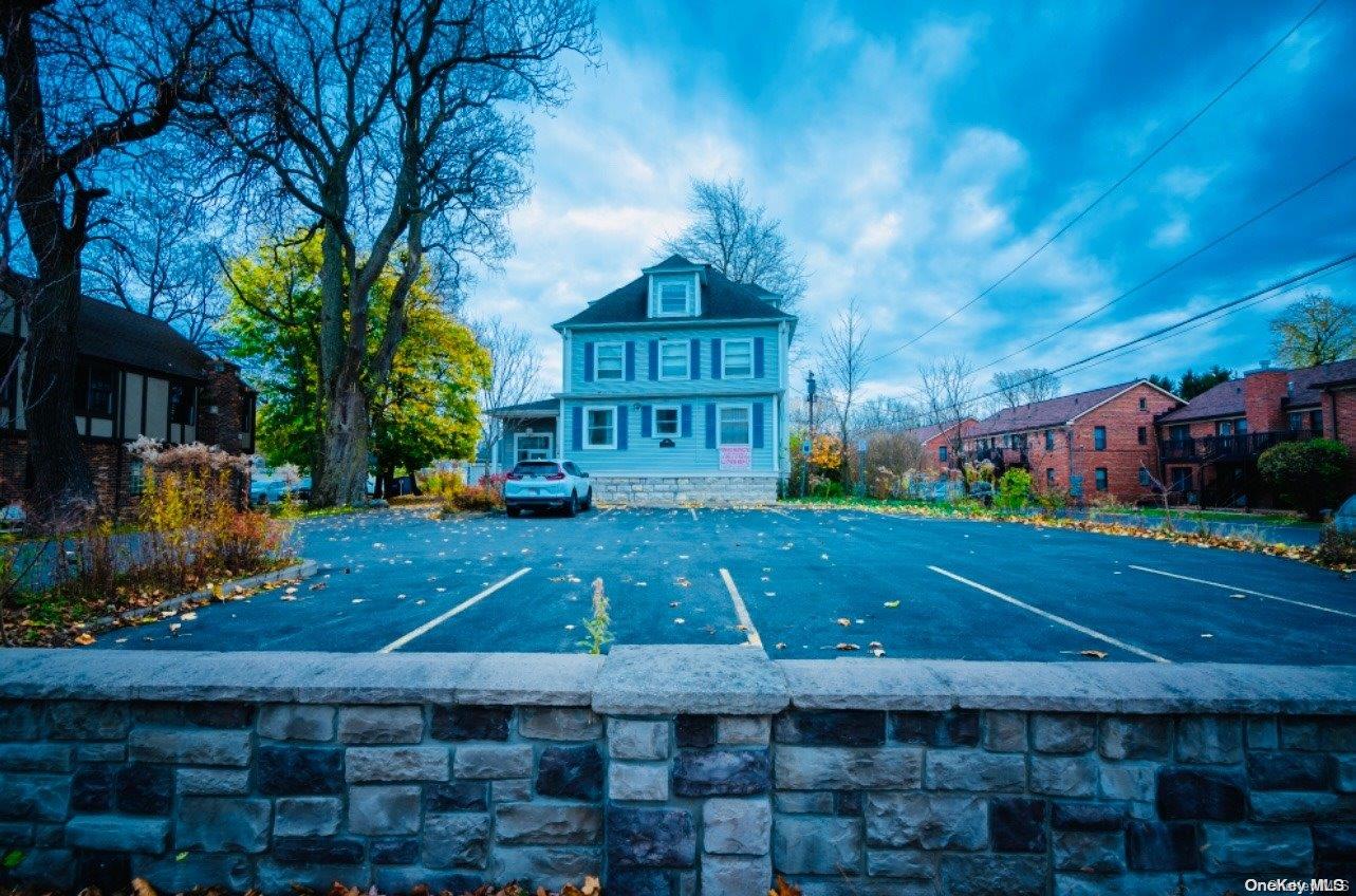 a view of a building with a yard