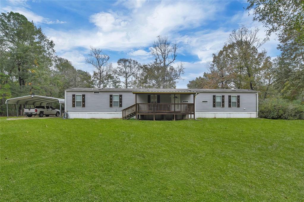 a view of a house with a back yard