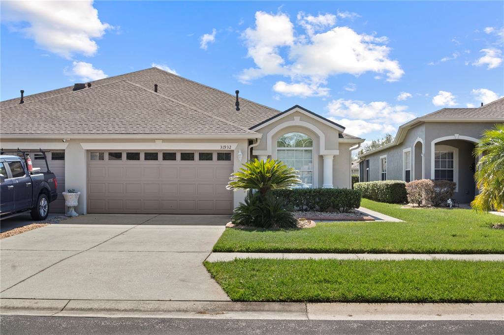 a front view of a house with a yard