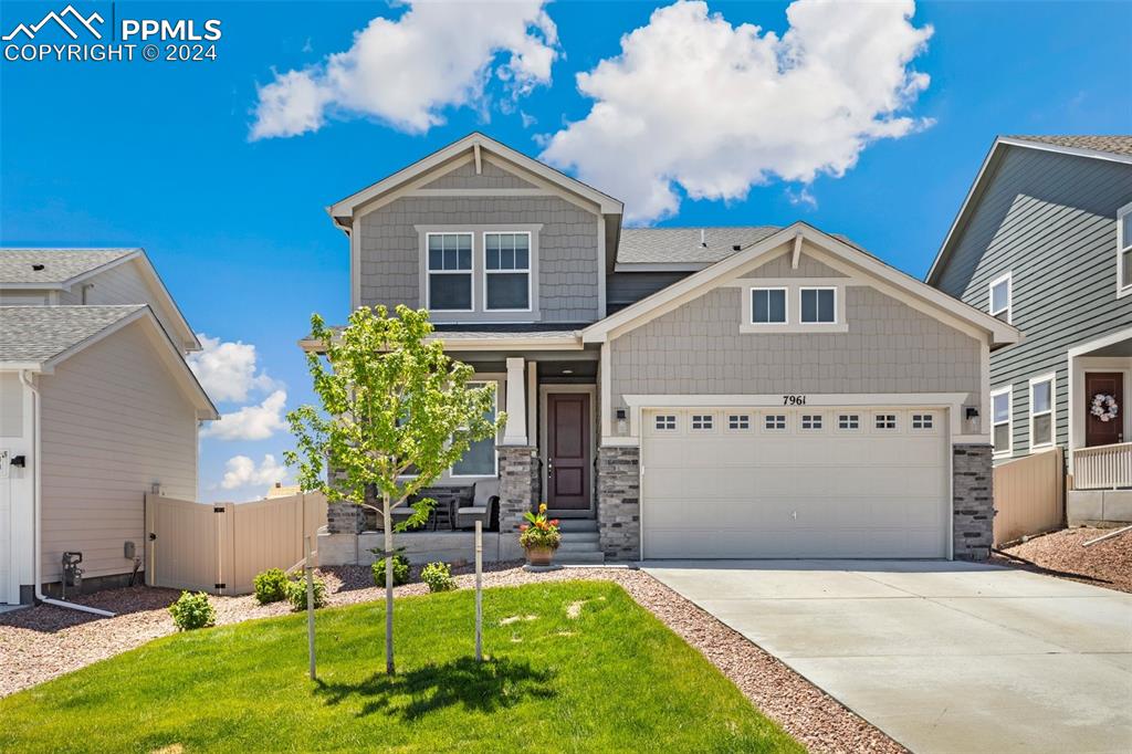 Craftsman house with beautifully landscaped front yard