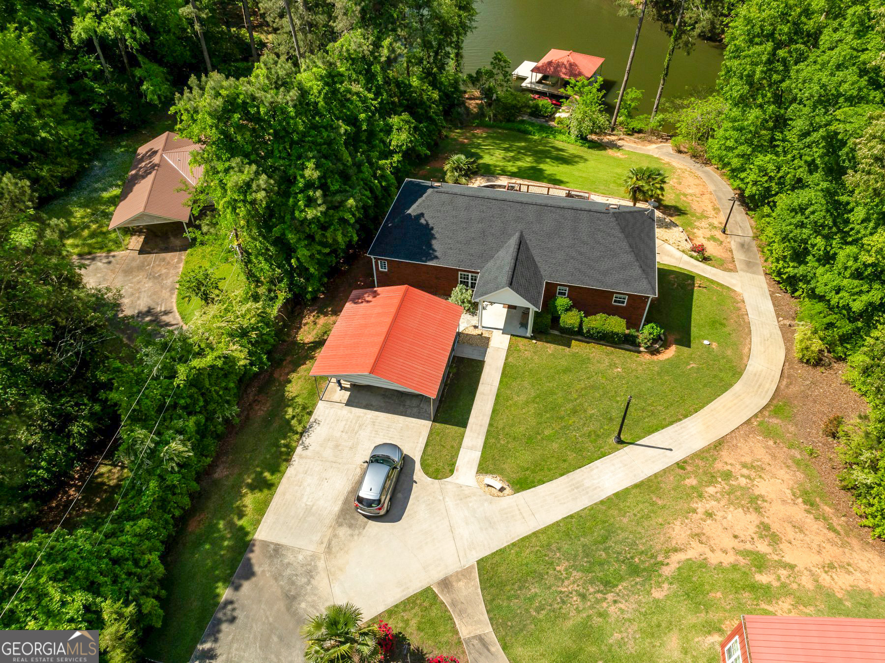 an aerial view of a house with a swimming pool