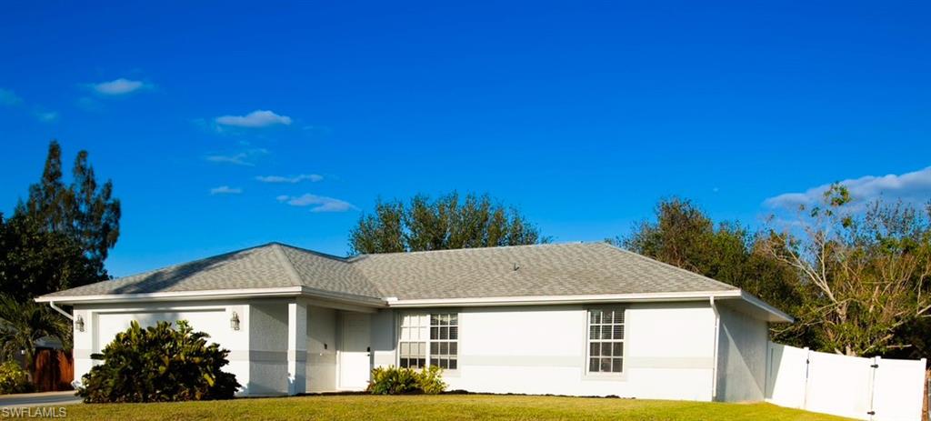 Ranch-style house with a front lawn