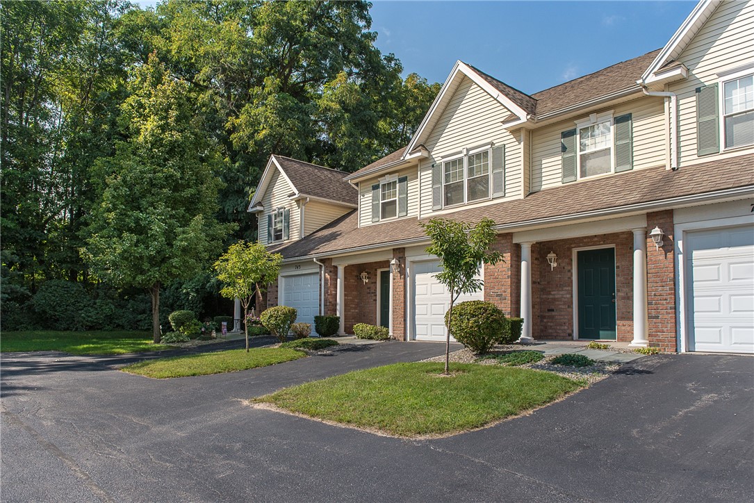 Typical exterior of townhomes at Webster Woods. Fu