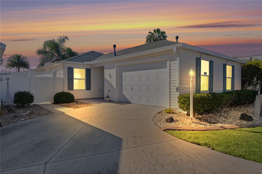 a front view of a house with yard