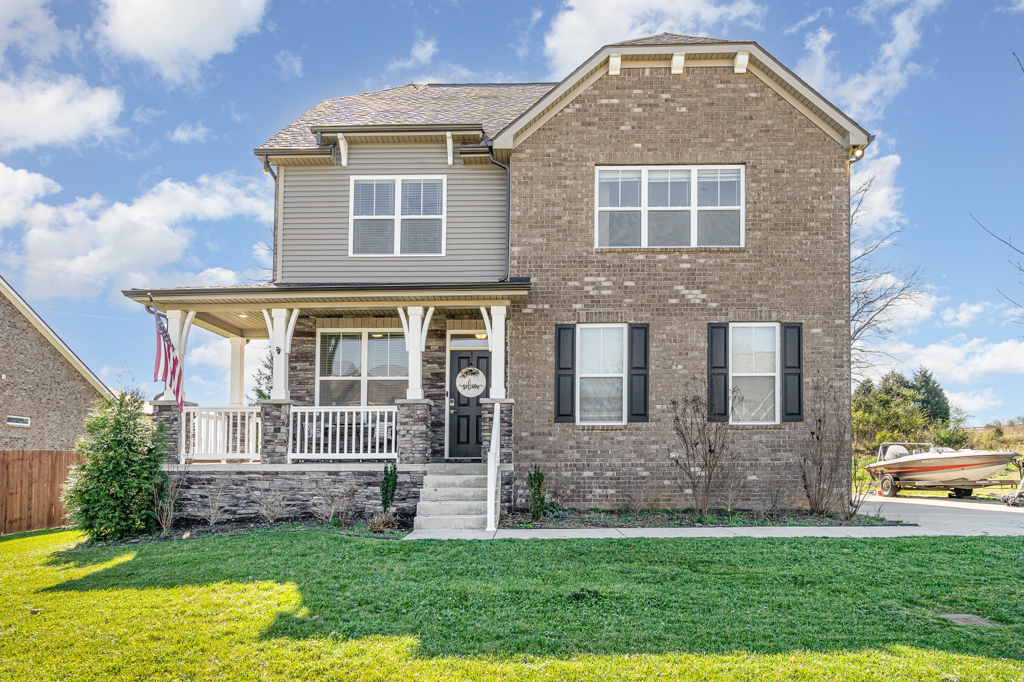 a front view of a house with a yard