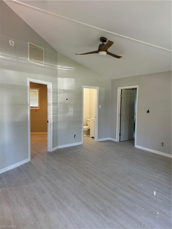 a view of a big room with closet and windows