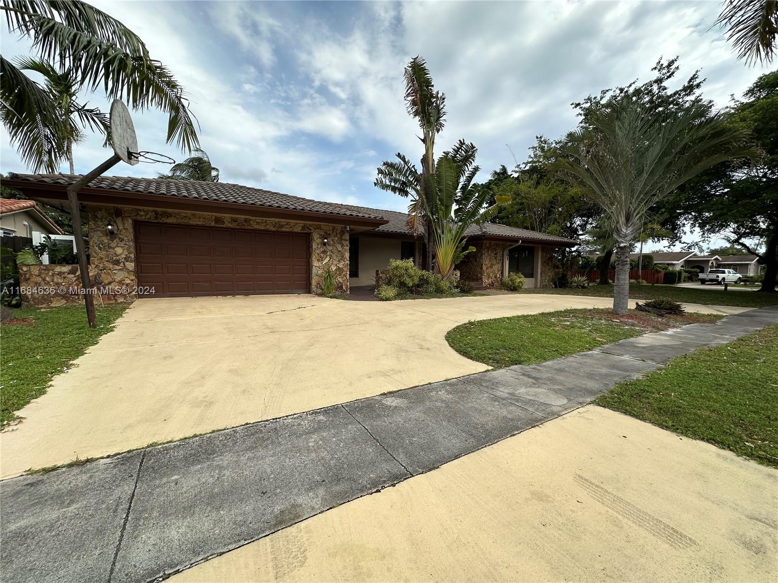 a house with palm tree in front of it