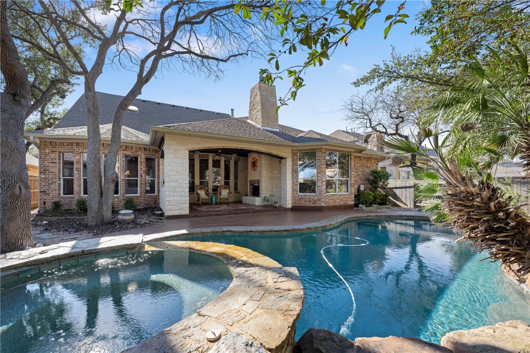 a view of a house with swimming pool