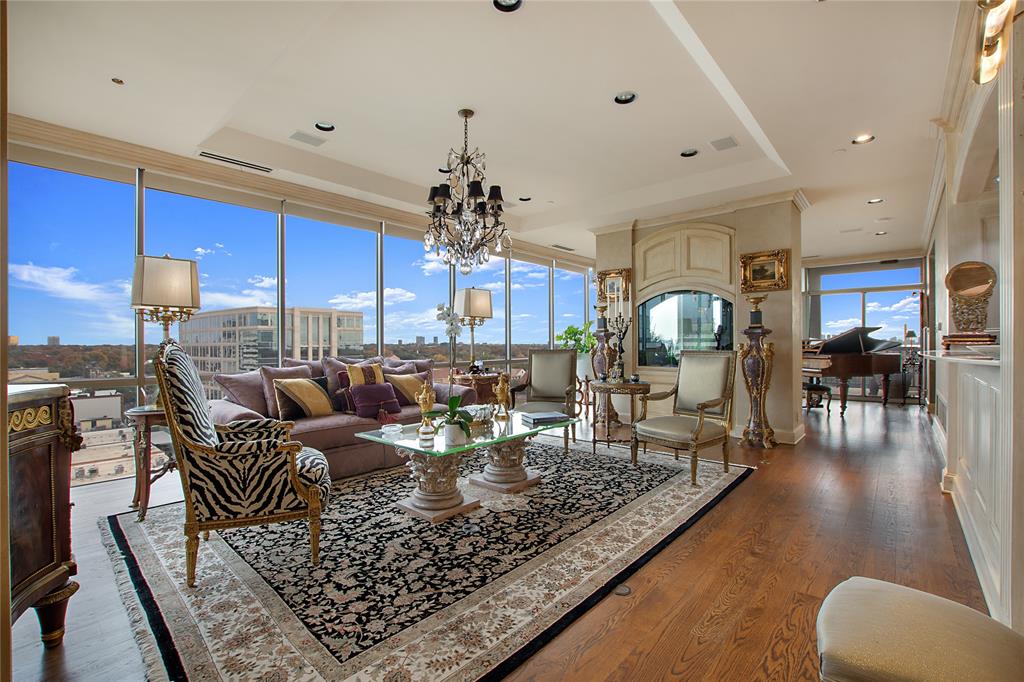 a living room with lots of furniture and a rug