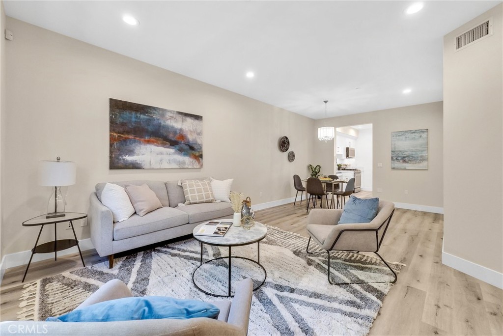 a living room with furniture and a rug