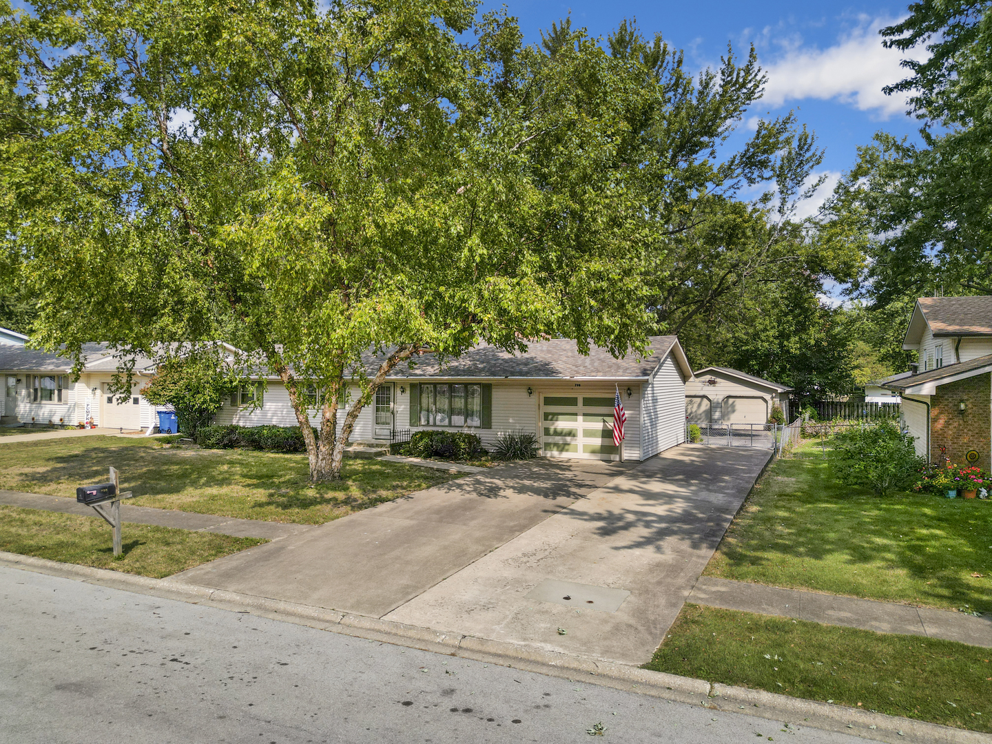 front view of a house with a yard