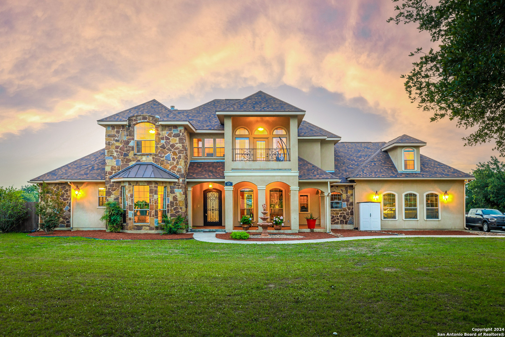 a front view of a house with a yard